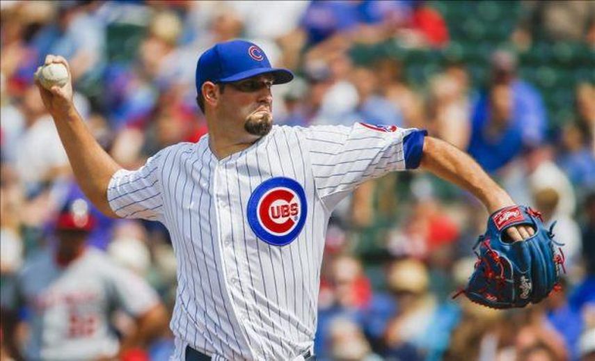 7-6. Hammel tiene el respaldo de una lluvia de jonrones y vence a los Cerveceros